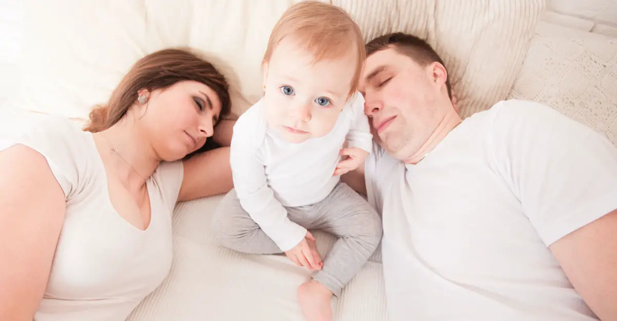baby with sleeping parents