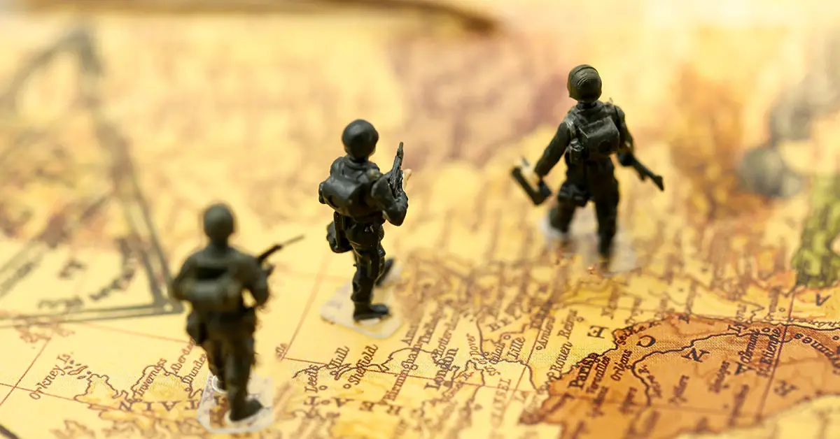 soldiers standing on a map