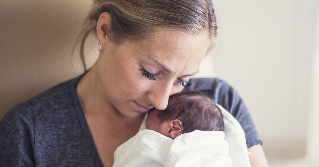 Babywearing NICU Nurses Show Preemie Babies Extra Love While Their Families Are Away - Featured image