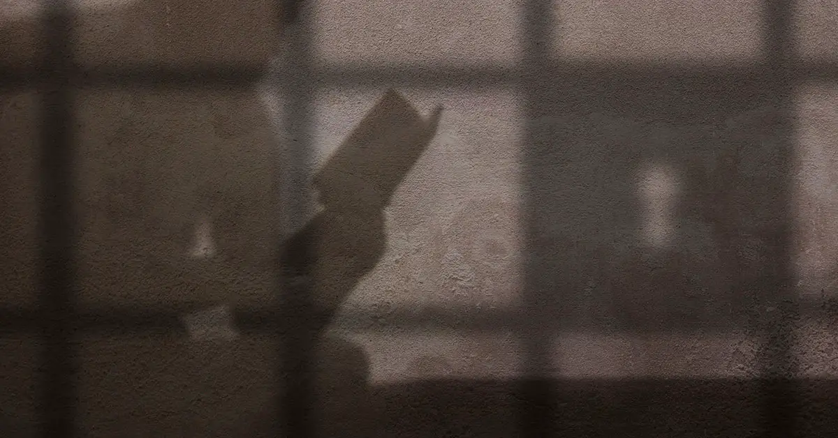 shadow of person in jail