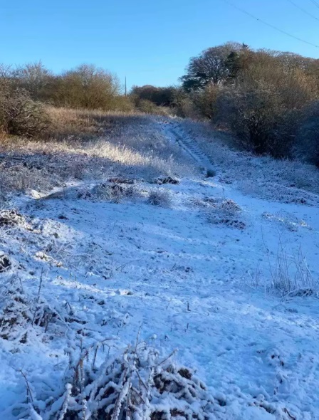 snowy field with concrete stairs