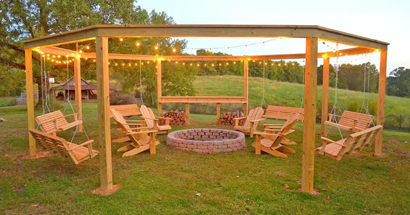 Pergola with swings and a firepit