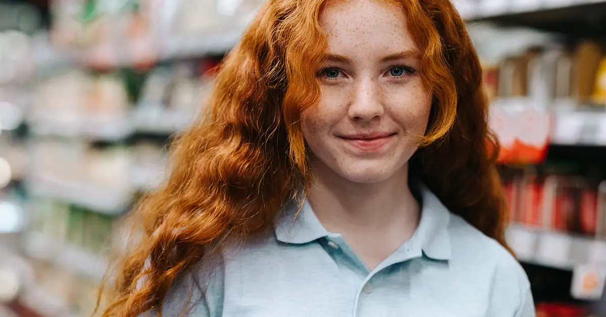 girl with red hair in grocery store