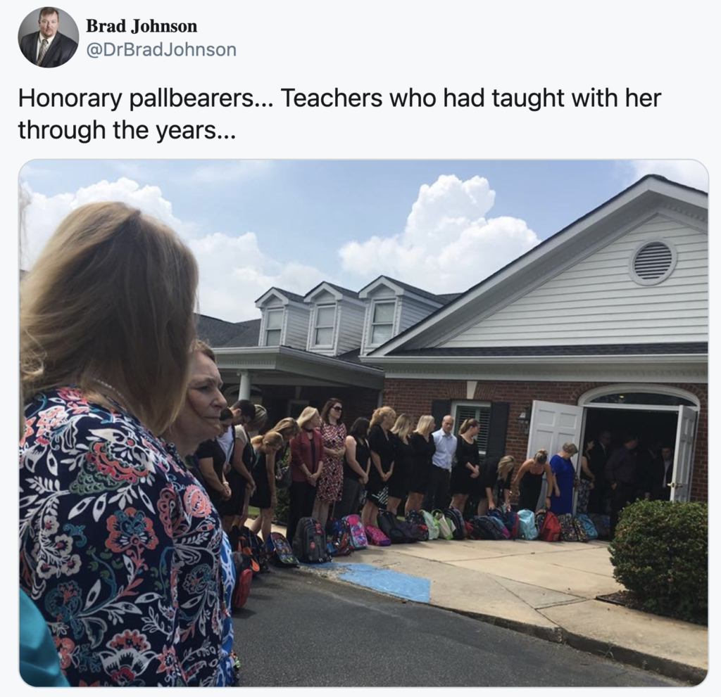 People lined up with backpack donations for a their friends funeral.