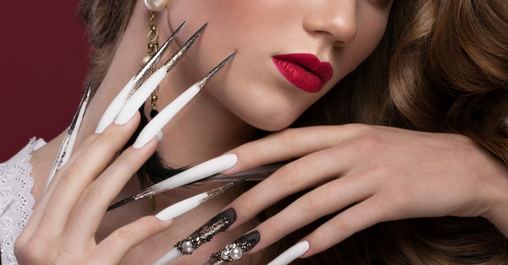 Woman with the world’s longest nails cuts them after nearly 30 years - Featured image