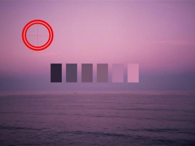 the ocean at sunset with a purple hue. 6 swatches of colour overlayed with what looked like a red target in the top left corner