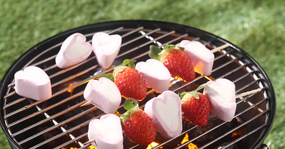 campfire strawberries being made over a bbq grill