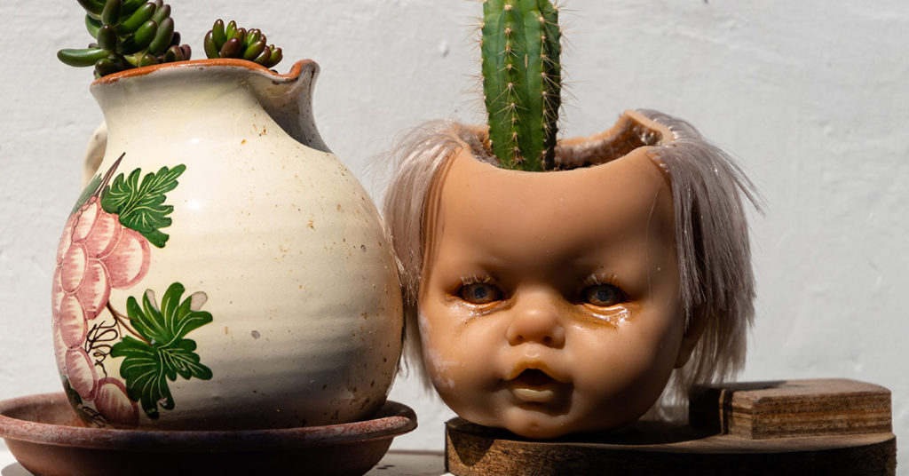 Turning Doll Heads Into Planters Is The Latest Home Decor Trend - Featured image