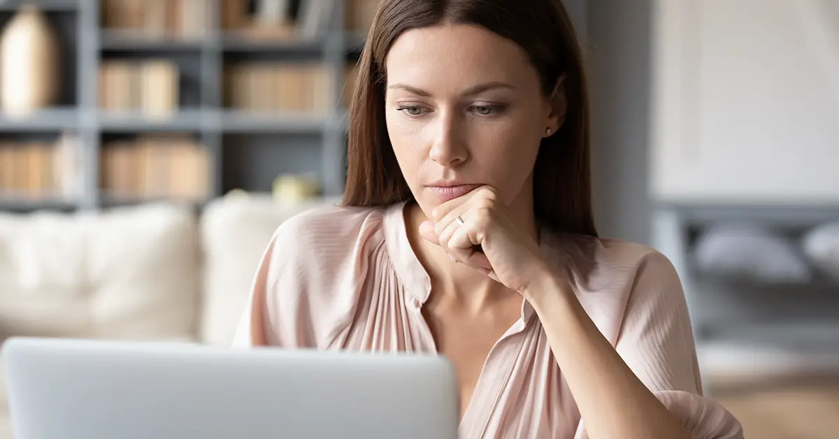 woman looking rather stumped by something on her computer