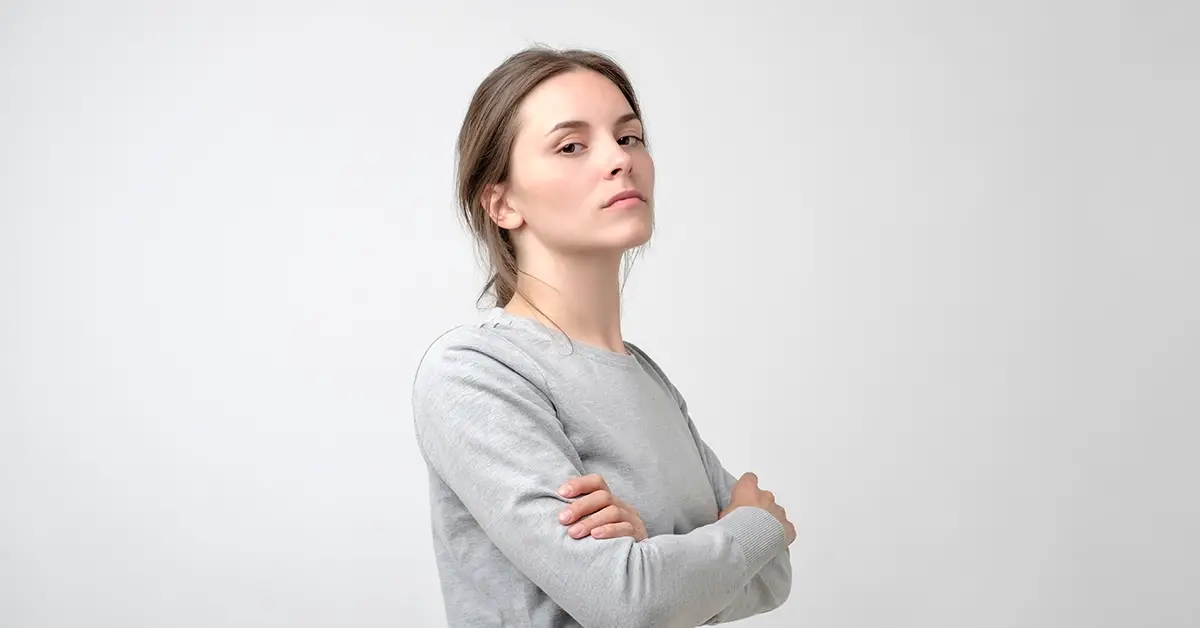 upset woman in a gray shirt