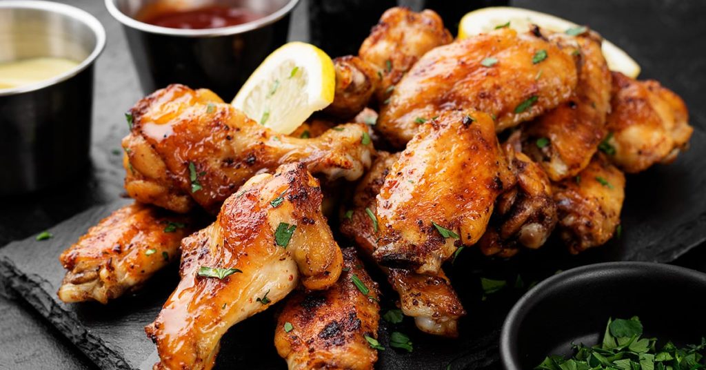 People Are Divided Over How Much Meat You Should Eat Off Chicken Wings - Featured image
