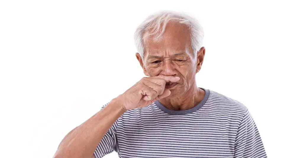 elderly man with with the sniffles