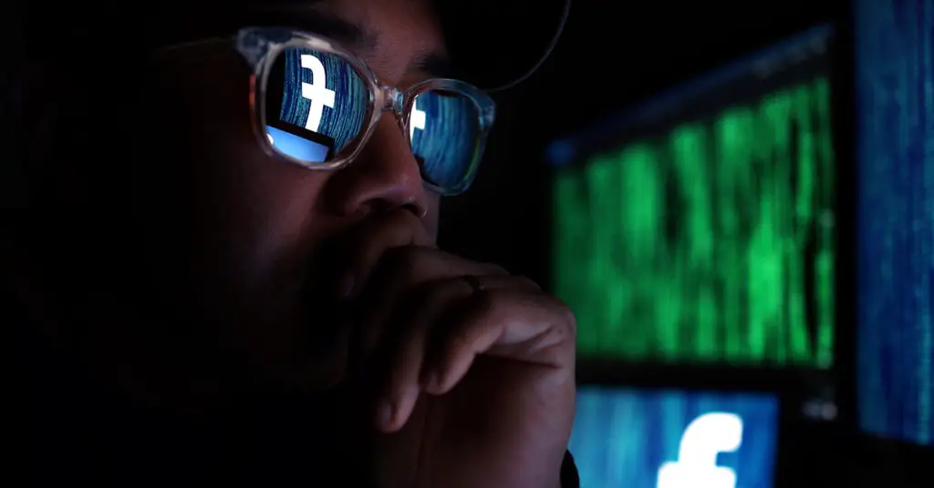 hacker viewing facebook