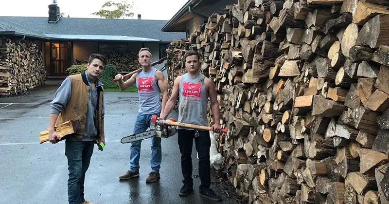 3 men chopping firewood