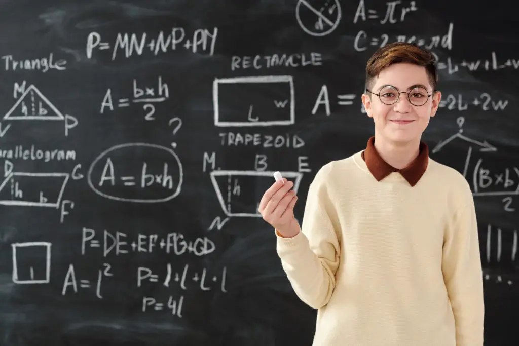 young math genius in front of a chalkboard littered with equations