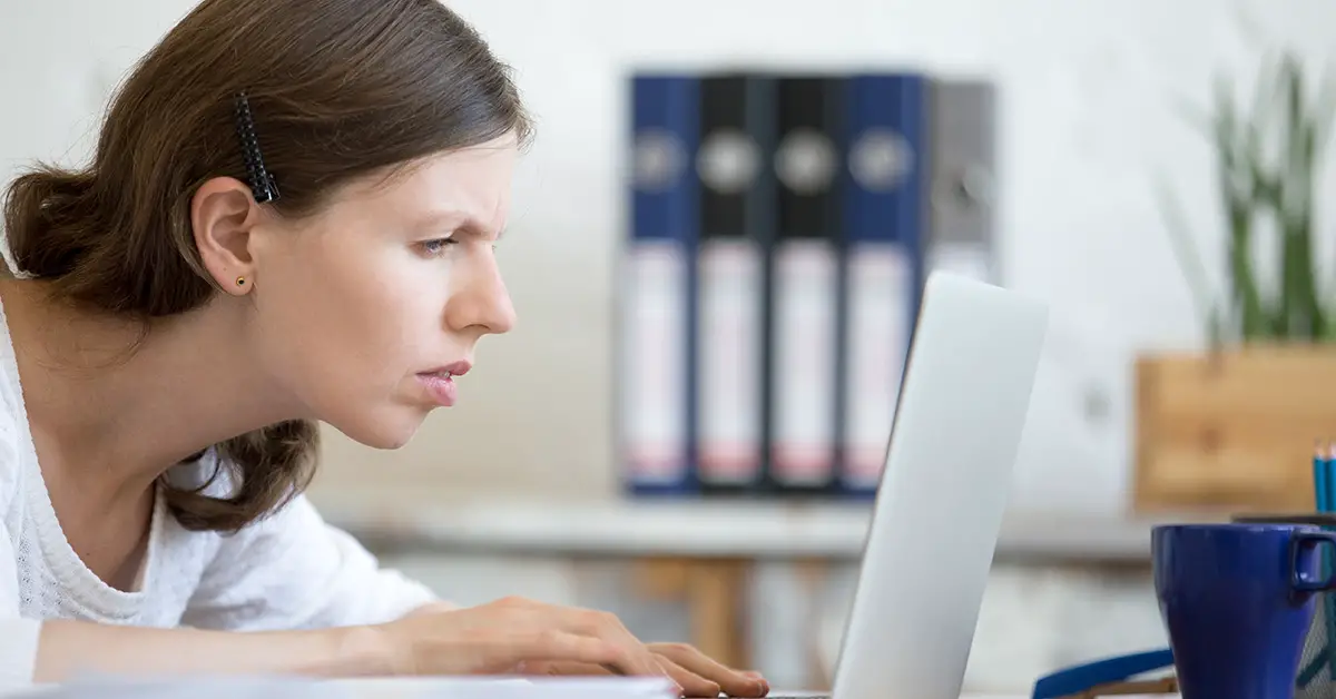 woman staring at computer screen