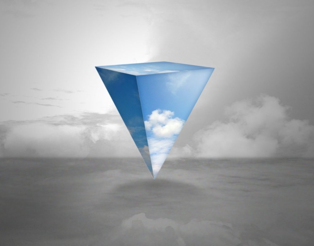 inverted polyhedron containing a blue sky with some clouds