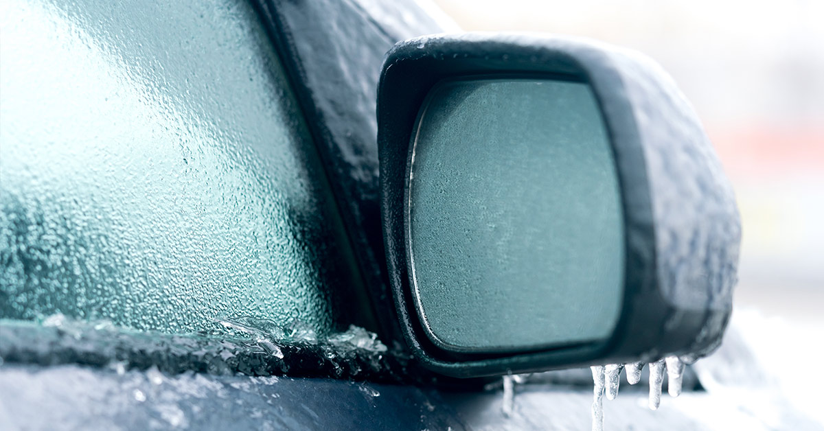 icy car window and side view mirror