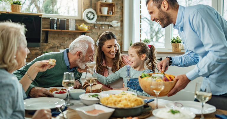 Find The Odd Thing About This Image of a Family Sitting Down for Dinner Together - Featured image
