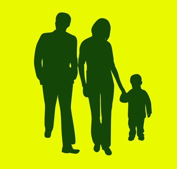 silhouette image of a  three person family. A little boy (right), a father (left) and mother (middle). 