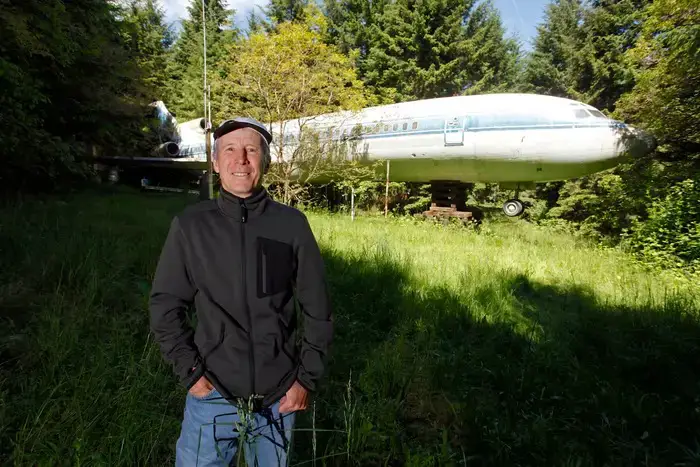 Bruce Campbell with his house-cum-plane in the background.