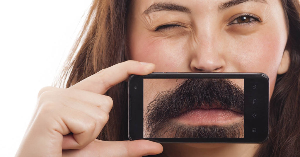 Woman decides to fully embrace her facial hair and grow a beard - Featured image