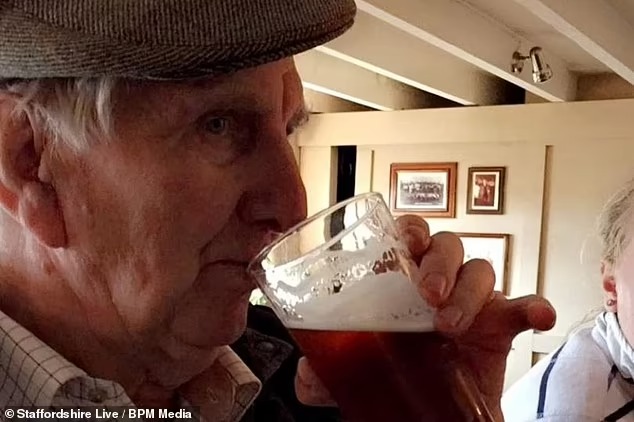 Farmer George Brookes having a drink.