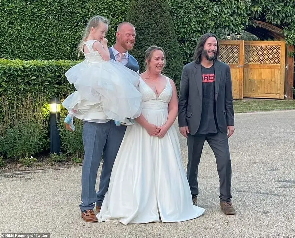 Keanu Reeves at the UK wedding ceremony besides Nikki and and James.