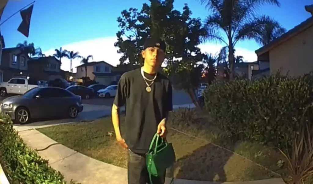 Adrian Rodriquez returning a purse, seen on a Ring doorbell cam