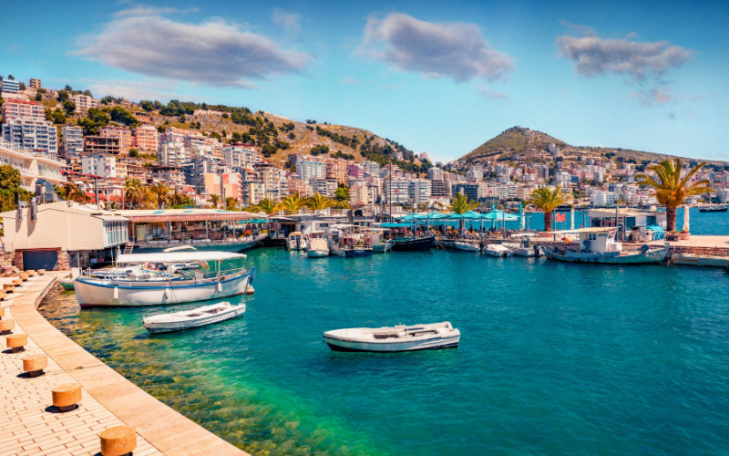 Perfect spring cityscape of Saranda port. Picturesque Ioninian seascape. Bright morning scene of Albania, Europe. Traveling concept background.