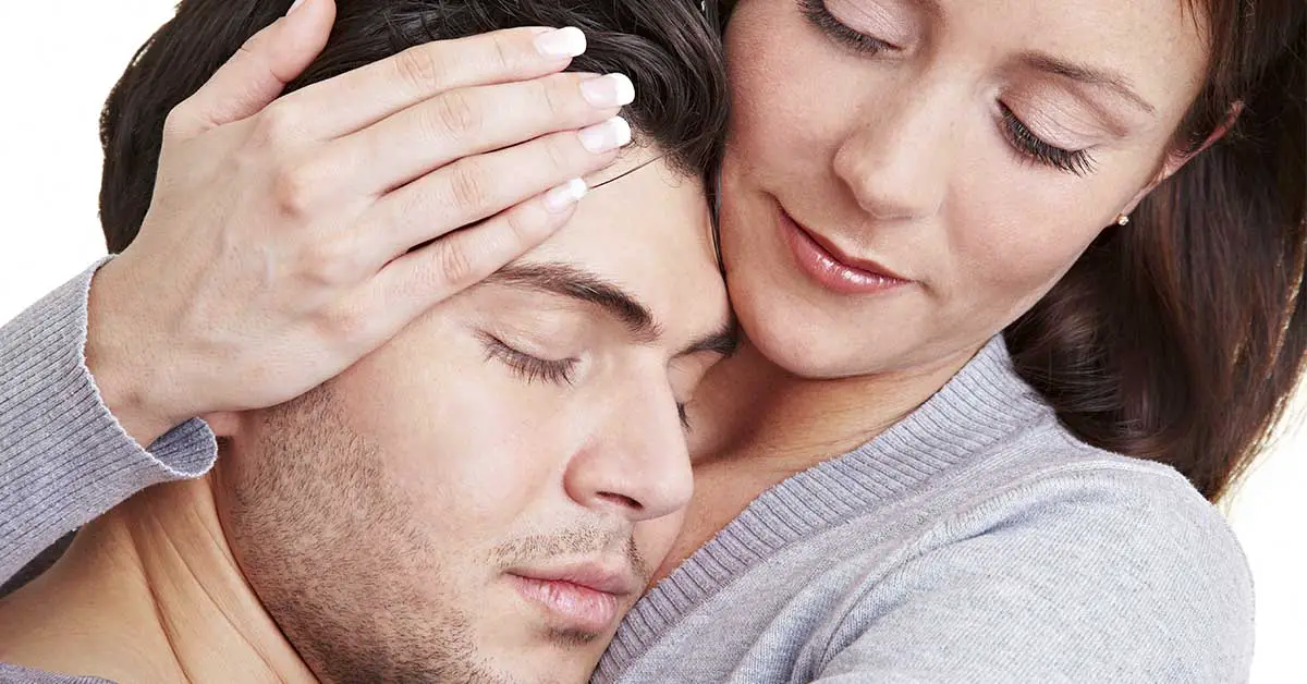 woman cuddling and embracing a man