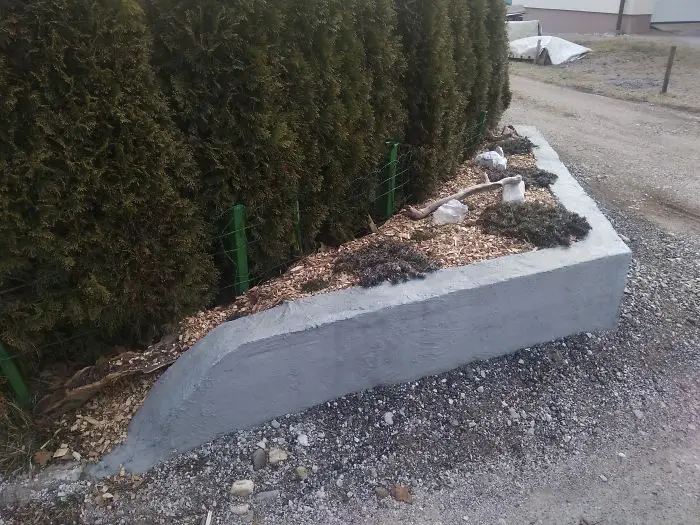 The concrete fence that OP and their father built.