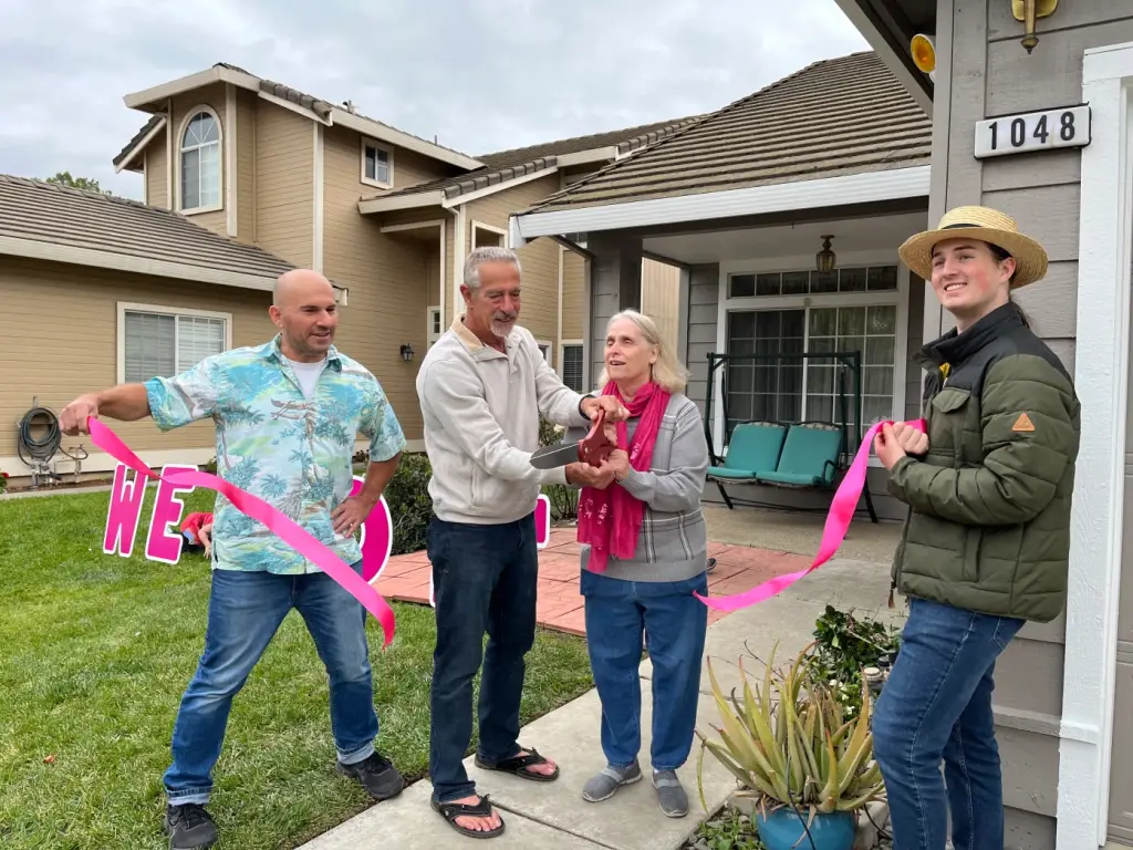 Paul Bridge, Stu Kahn, Faye Abbas, and Matthew Nagle cut the ribbon to Fya's newly renovated home