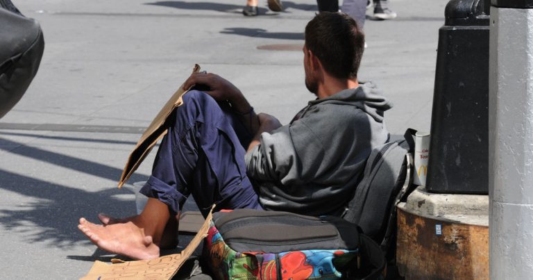 Store Employee Gives Shoes To Man Wearing Boxes On Feet - Featured image