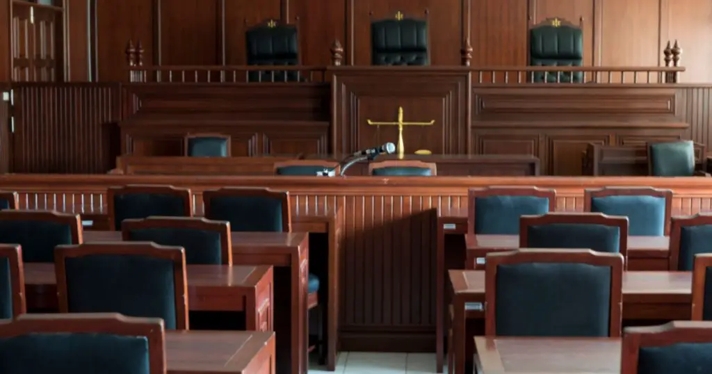 Table and chair in the courtroom of the judiciary.
