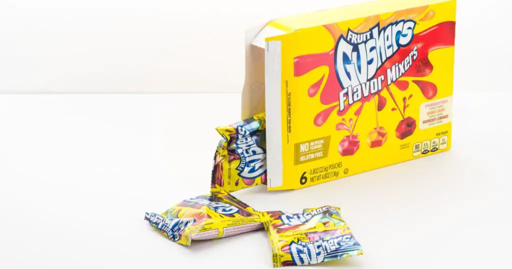 St. Joseph, Missouri / United States of America - September 22nd, 2019 : Gushers fruit snacks, on white surface with white background, flavor mixers variety.
