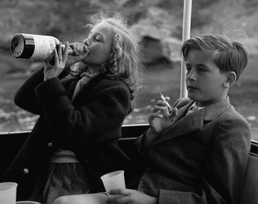 children smokign and drinking . Princess Yvonne and Prince Alexander in Germany in 1955
