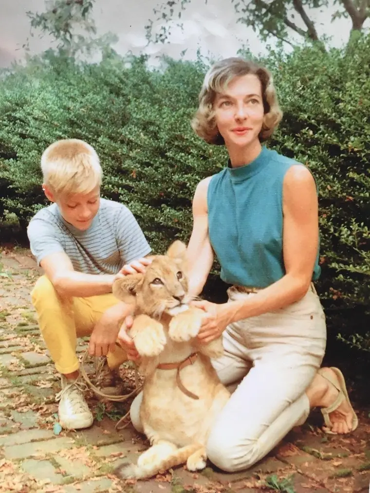 Mother and son with pet lion 1959