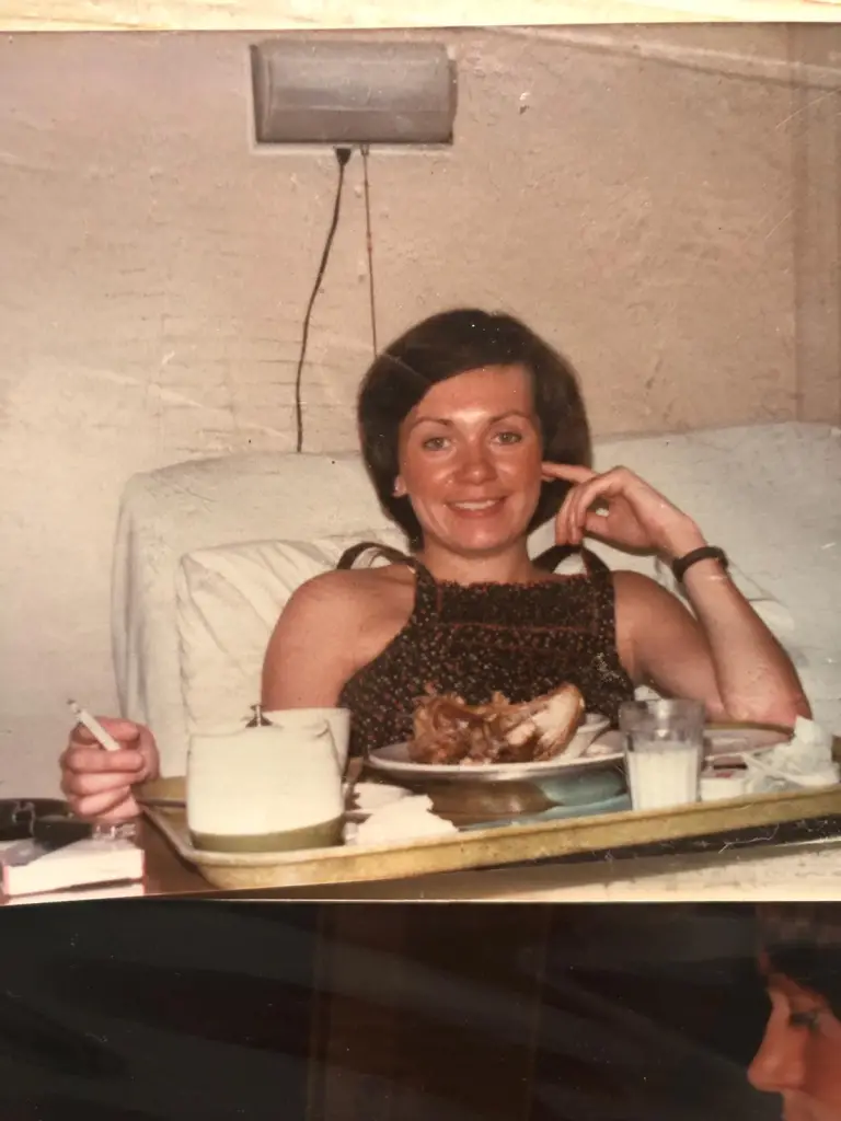 mom in Canada in 1978 after just having given birth. She's chilling out having a roast chicken and smoking a cigarette