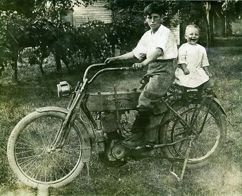 father and baby on motorbike