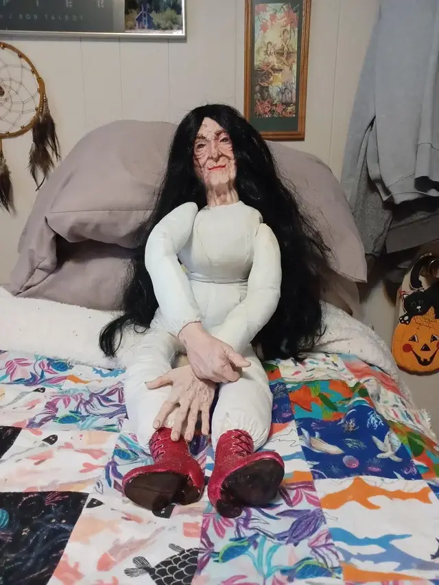 scary doll on bed