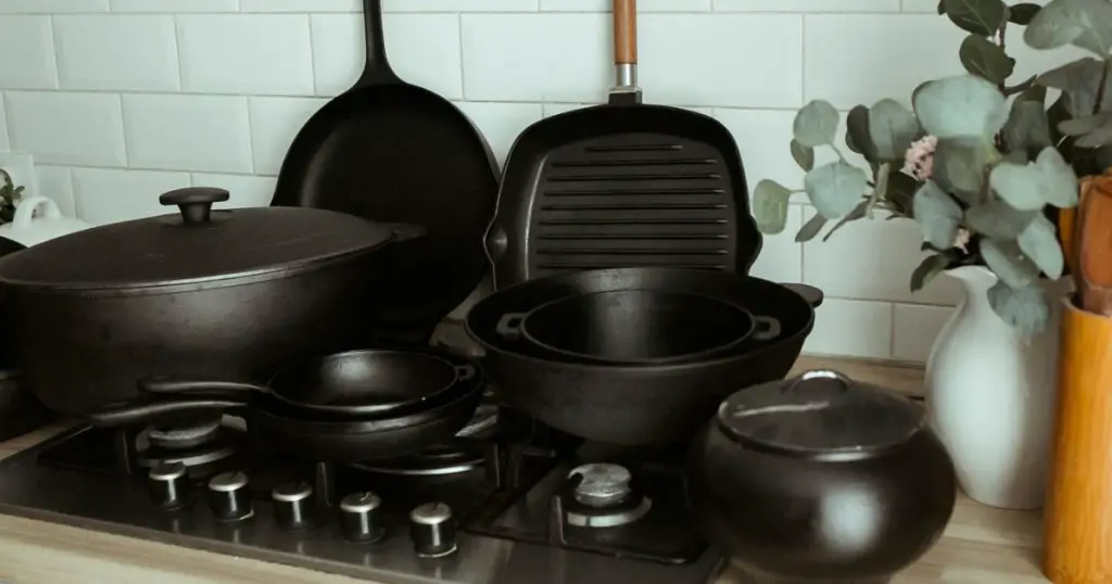 Composition from a set of cast-iron utensils. Cast iron for home use. Cooking in cast iron cookware.
