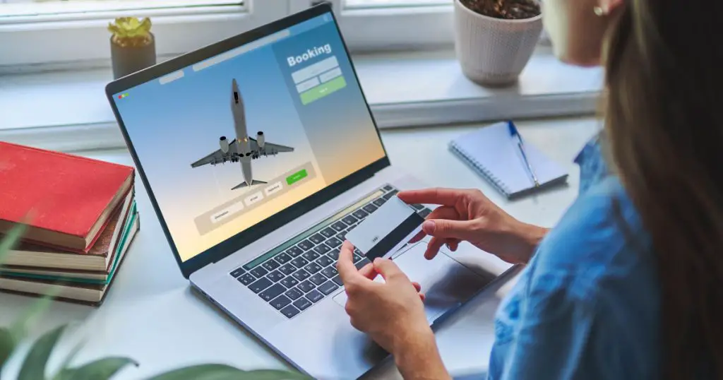 Online booking and buying plane tickets using computer and credit card
