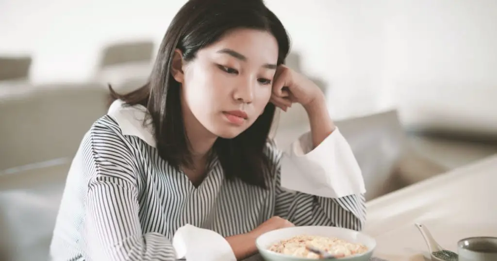 Asian young woman eating food