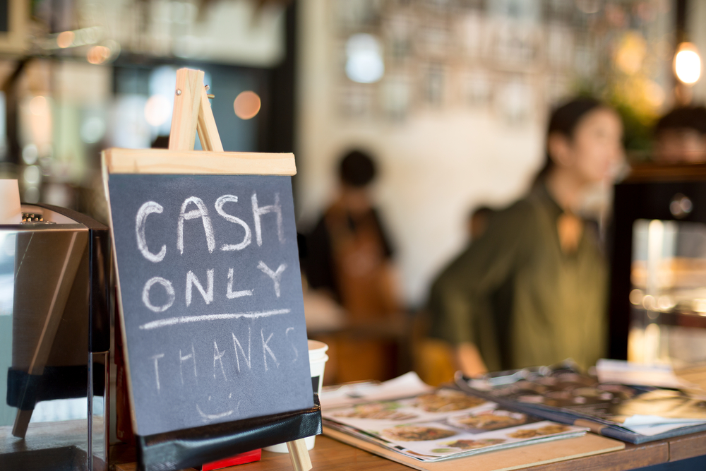 Selected focus cash only letter showing on counter consumer purchases using money