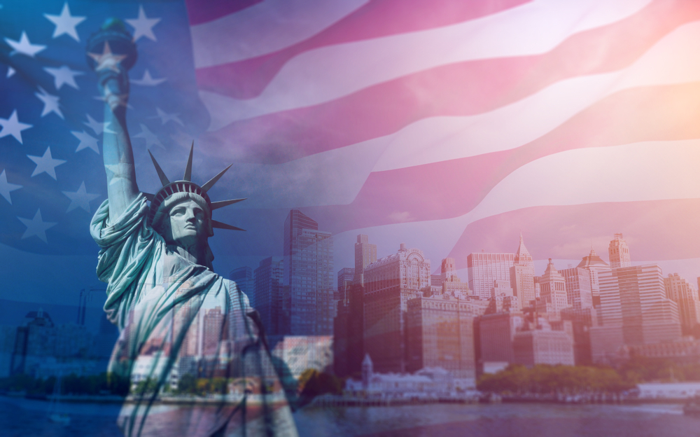 Double exposure with the American flag and the Statue of liberty. Background for independence day - 4th of July.