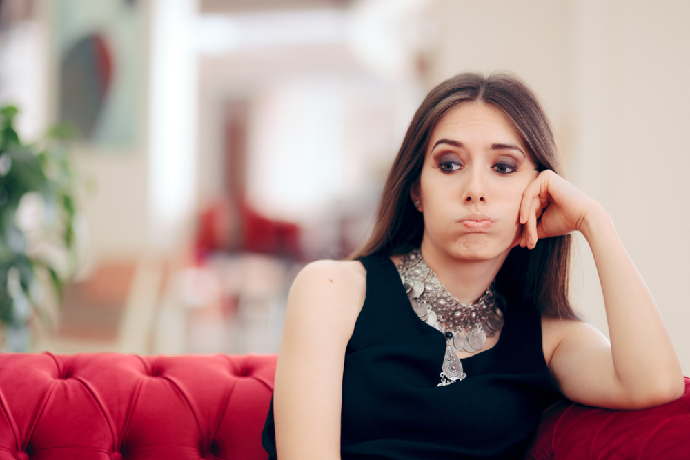 woman sitting on couch