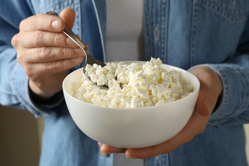 woman holding bowl of cottage cheese