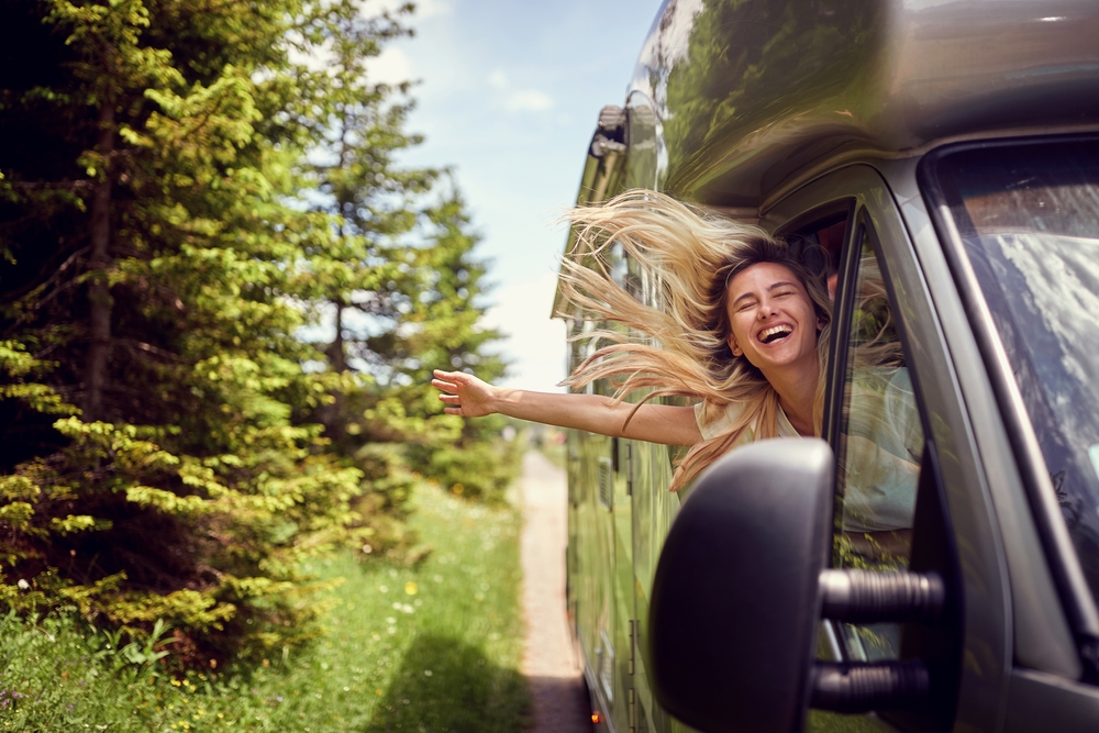 woman in camper van on roadtrip