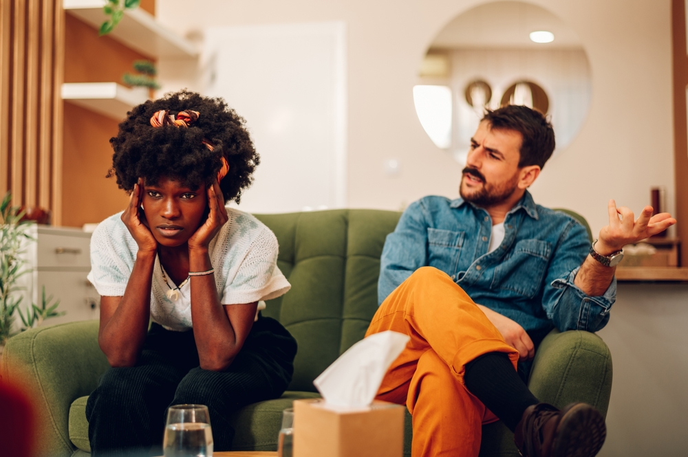 angry couple on couch